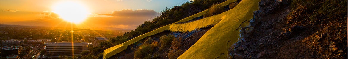 side view of "A" Mountain with a sunset in the background