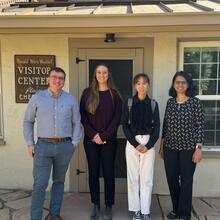 Dr. Nick Wise, undergrad student Katelyn Skabelund, PhD student Ziming Jin and Dr. Megha Budruk pose outside the Donald Ware Waddell Visitor Center