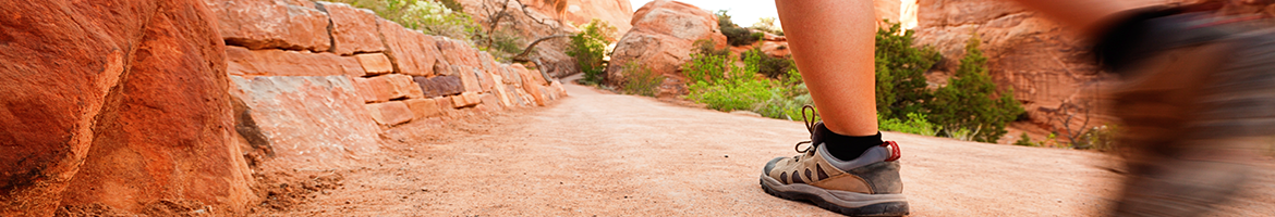 person hiking on a mountain trail